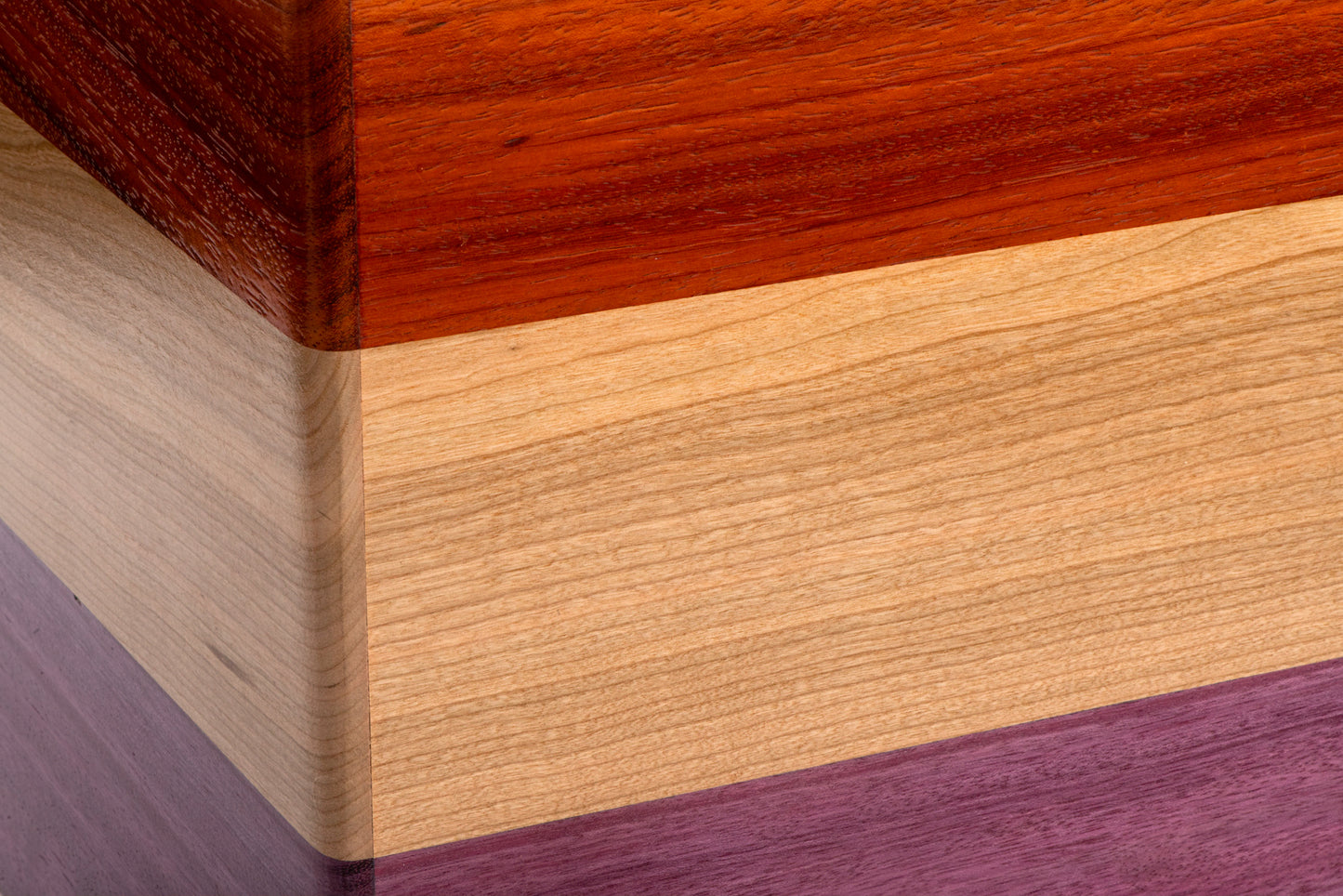 Solid padauk, cherry, and purple heart cajon with matching external snare.